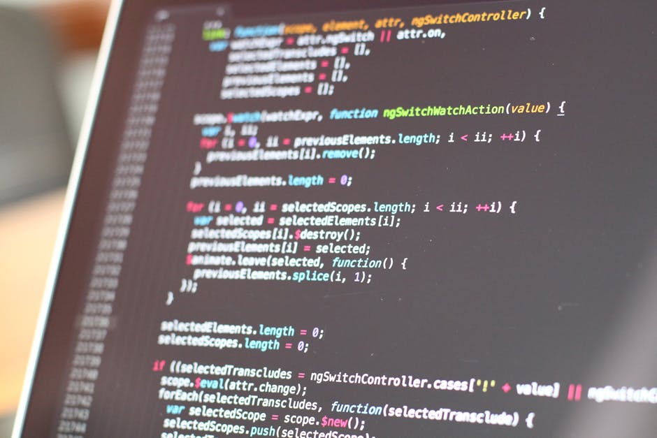 A detailed close-up of a computer screen displaying HTML code with colorful syntax highlighting, featuring lines of code that include headings, links to images labeled 'bibek's photo', and CSS classes