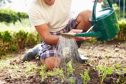 Gardener pruning plants in a lush garden
